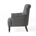Fauteuil club capitonné Bernstein à dossier roulé par