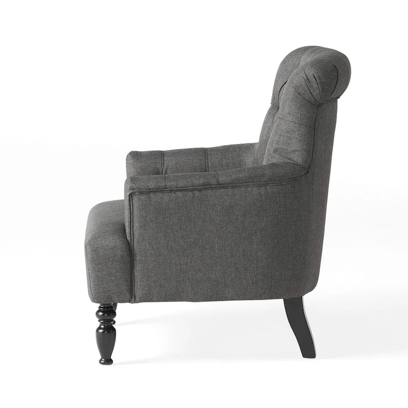 Fauteuil club capitonné Bernstein à dossier roulé par