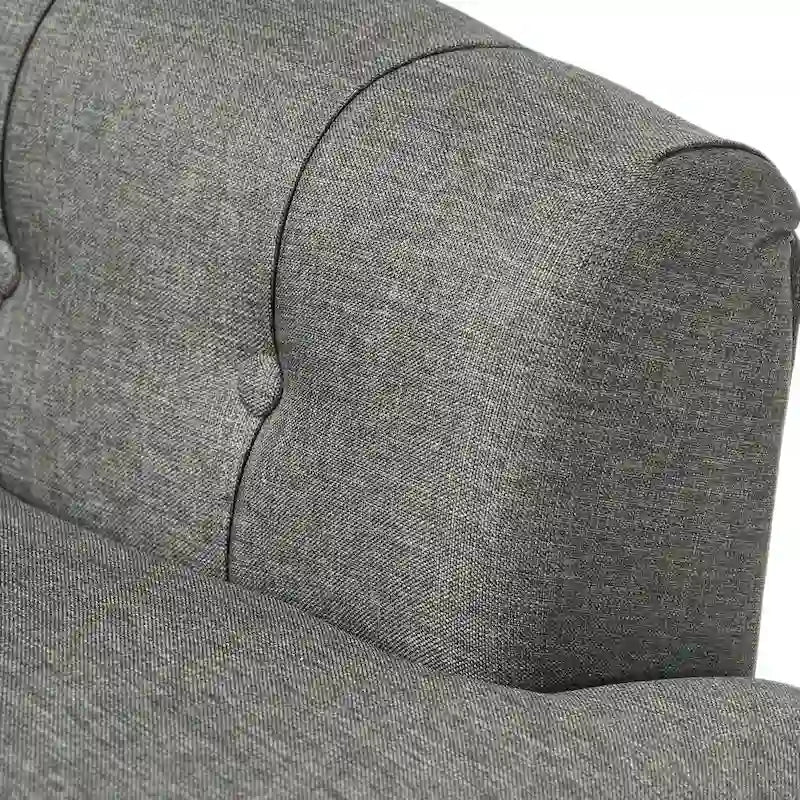 Fauteuil club capitonné Bernstein à dossier roulé par