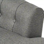 Fauteuil club capitonné Bernstein à dossier roulé par